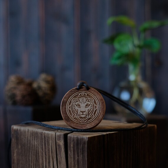 Celtic Style Lioness Necklace/Pendant. Made from solid sycamore wood. Round shape. Brown color. Adjustable cotton cord.