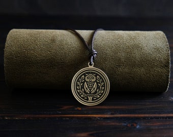 Goddess Athena Owl Symbol Necklace/Pendant. Made from solid brass. Round shape. Brass color. Adjustable leather cord.