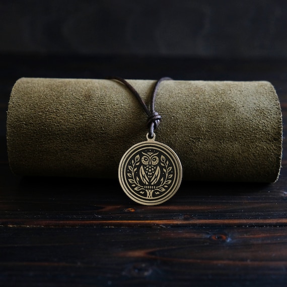 Goddess Athena Owl Symbol Necklace/Pendant. Made from solid brass. Round shape. Brass color. Adjustable leather cord.