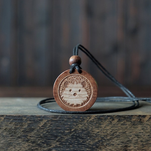 Hedgehog Necklace/Pendant. Made from solid sycamore wood. Round shape. Brown color. Adjustable cotton cord. Text customization.