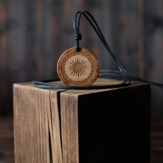 Helios God Symbol Necklace/Pendant. Made from solid sycamore wood. Round shape. Brown color. Adjustable cotton cord. Text customization.