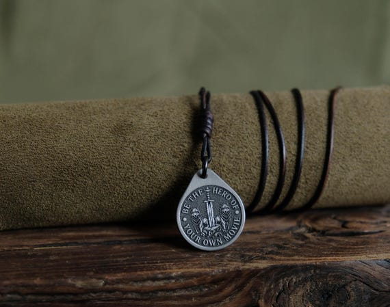 Titanium Wolf Pendant — Be the Hero, Leather Cord, Brass Beads