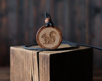 Squirrel Necklace/Pendant. Made from solid sycamore wood. Round shape. Brown color. Adjustable cotton cord.