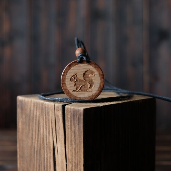 Squirrel Necklace/Pendant. Made from solid sycamore wood. Round shape. Brown color. Adjustable cotton cord.