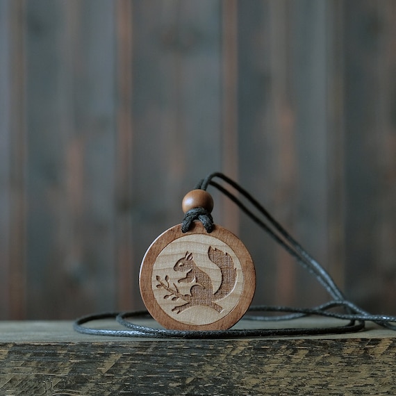 Squirrel Necklace/Pendant. Made from solid sycamore wood. Round shape. Brown color. Adjustable cotton cord.