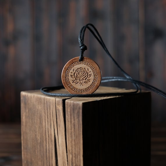 Aphrodite Goddess Necklace/Pendant. Made from solid sycamore wood. Round shape. Brown color. Adjustable cotton cord. Text customization.