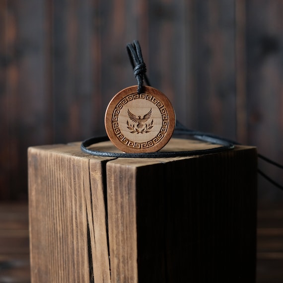 Aphrodite Goddess Necklace/Pendant. Made from solid sycamore wood. Round shape. Brown color. Adjustable cotton cord. Text customization.