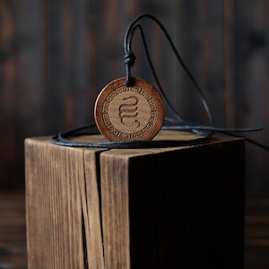 Wood Necklace-Serpent Egg Necklace, Orphic Egg. Made from solid sycamore wood. Round shape. Brown color. Adjustable cotton cord.