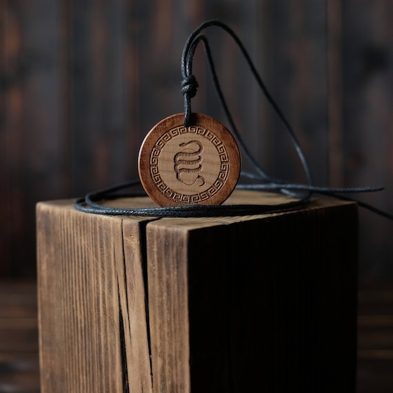 Wood Necklace-Serpent Egg Necklace, Orphic Egg. Made from solid sycamore wood. Round shape. Brown color. Adjustable cotton cord.