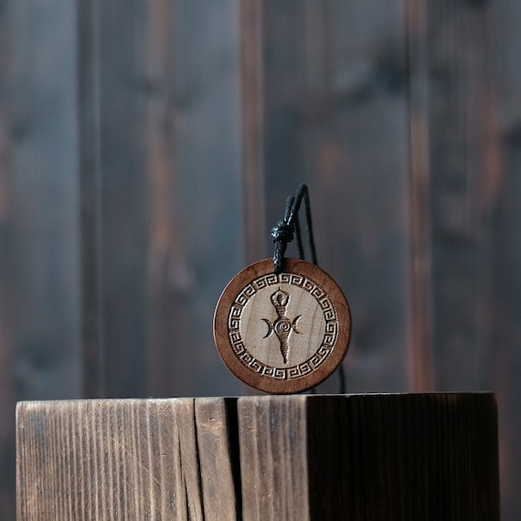 Goddess Gaia Necklace/Pendant. Made from solid wood. Brown colour, round shape. Adjustable black cotton cord.