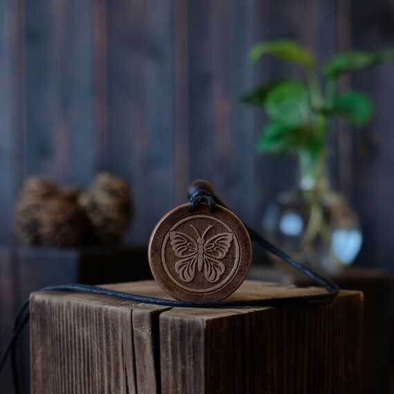 Butterfly Necklace/Pendant. Made from solid sycamore wood. Round shape. Brown color. Adjustable cotton cord. Text customization.
