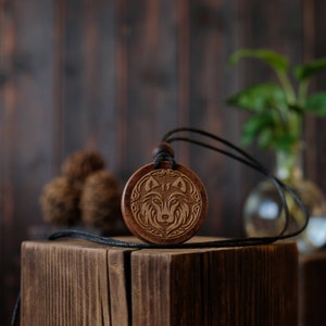 Wolf Wooden Necklace/Pendant. Made from solid sycamore wood. Round shape. Brown color. Adjustable cotton cord. Text customization.