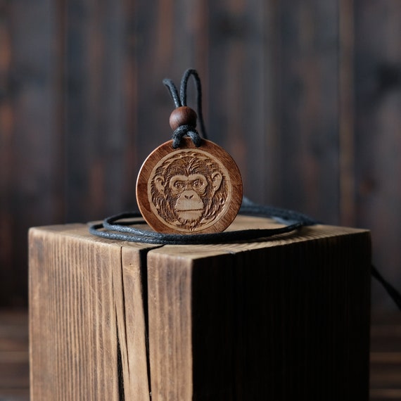 Chimpanzee Necklace/Pendant. Made from solid sycamore wood. Round shape. Brown color. Adjustable cotton cord. Personalization