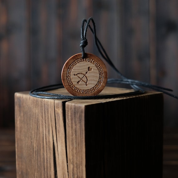 Eros God Symbol Necklace/Pendant. Made from solid sycamore wood. Round shape. Brown color. Adjustable cotton cord. Text customization.