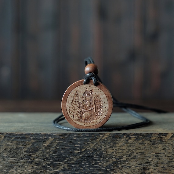 Squirrel Necklace/Pendant. Made from solid sycamore wood. Round shape. Brown color. Adjustable cotton cord.