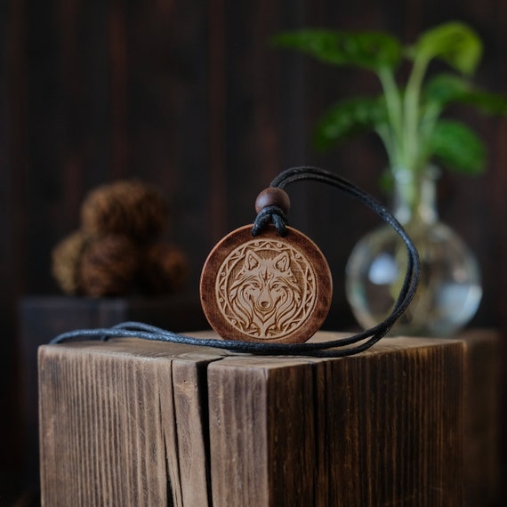 Wooden Necklace. Nordic Style Wolf Wooden Necklace/Pendant. Made from solid sycamore wood. Round shape. Brown color. Adjustable cotton cord.