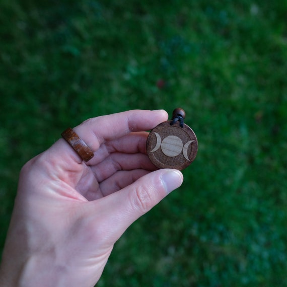 Triple Moon Goddess Necklace/Pendant. Made from solid sycamore wood. Round shape. Brown color. Adjustable cotton cord. Text customization.