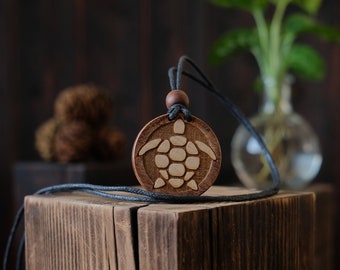 Turtle Wooden Necklace/Pendant. Made from solid sycamore wood. Round shape. Brown color. Adjustable cotton cord. Text customization.