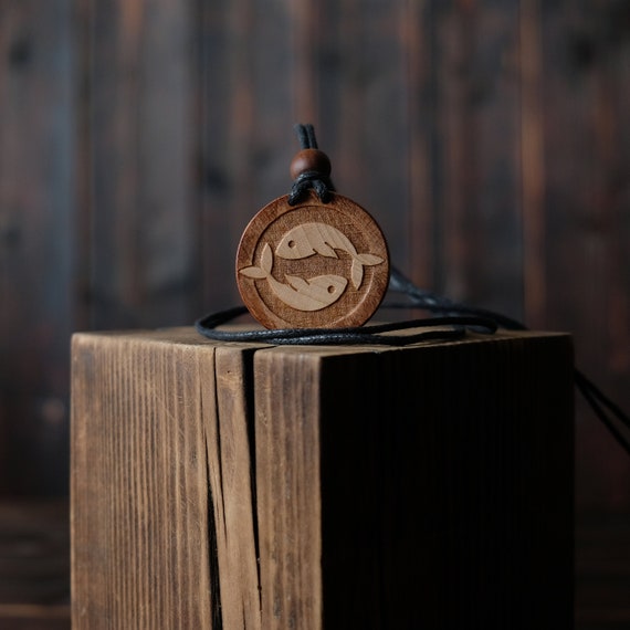 Pisces Necklace/Pendant. Made from solid sycamore wood. Round shape. Brown color. Adjustable cotton cord. Personalization