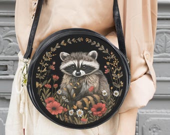 Raccoon in a meadow messenger bag: Boho purse with raccoon and flowers round shoulder bag