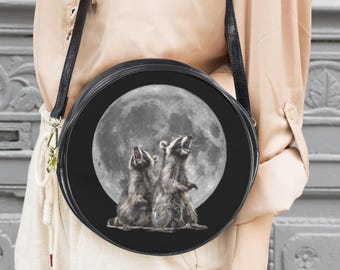 Raccoons howling at the full moon messenger bag: funny raccoon accessory, round purse 10"