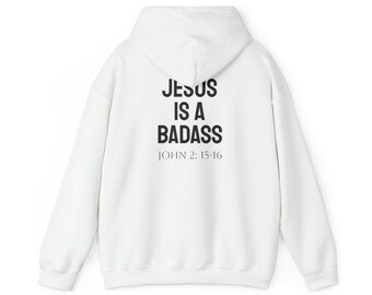 May include: White hooded sweatshirt with the text "JESUS IS A BADASS" in black, with "JOHN 2: 15-16" below. The sweatshirt has a drawstring hood and a kangaroo pocket.