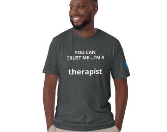 May include: A dark heather grey t-shirt with the text "YOU CAN TRUST ME...I'M A therapist" in white.