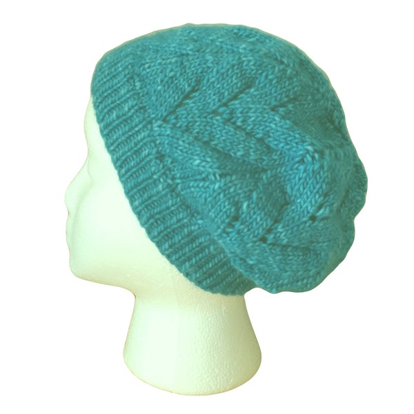 Peacock blue hat hand knit with merino wool.