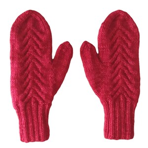 May include: A pair of red knitted mittens with a cable knit pattern.