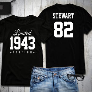 May include: Two black t-shirts with white text. One shirt says "Limited 1943 Edition" and the other says "Stewart 82".