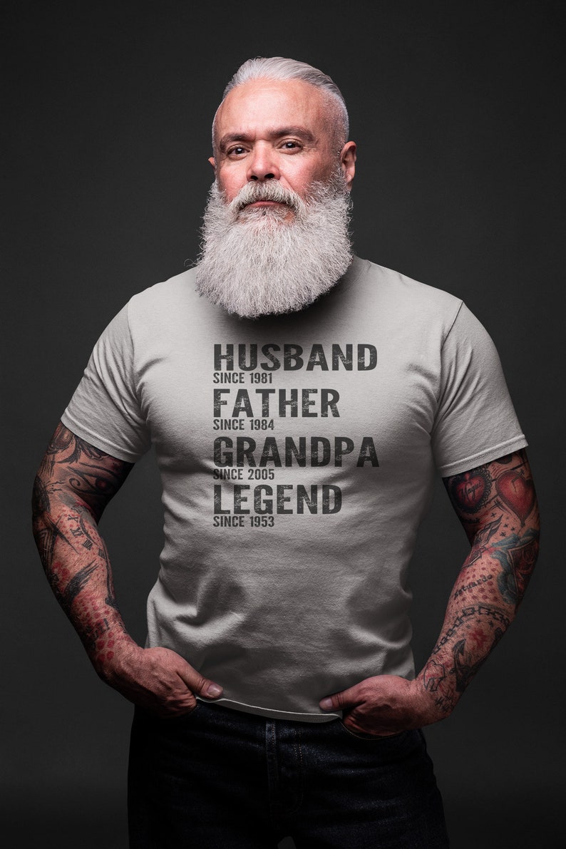 May include: A gray t-shirt with black text that reads "Husband since 1981, Father since 1984, Grandpa since 2005, Legend since 1953".