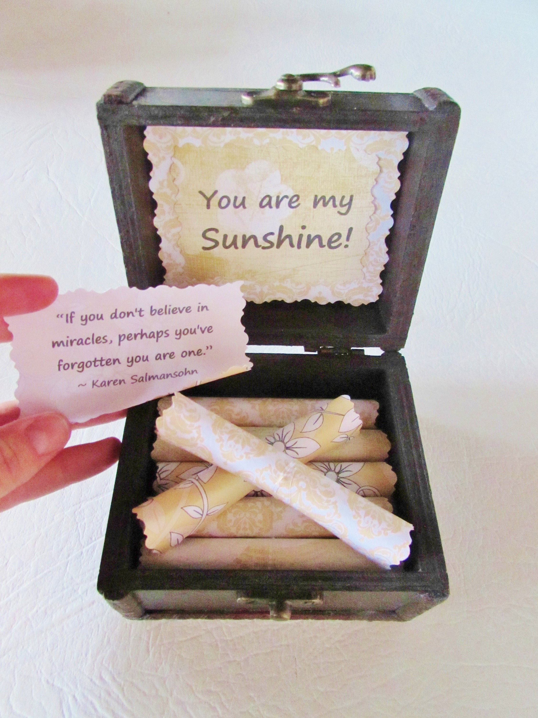 a box of sunshine sunny and inspiring quotes on scrolls in a wood box