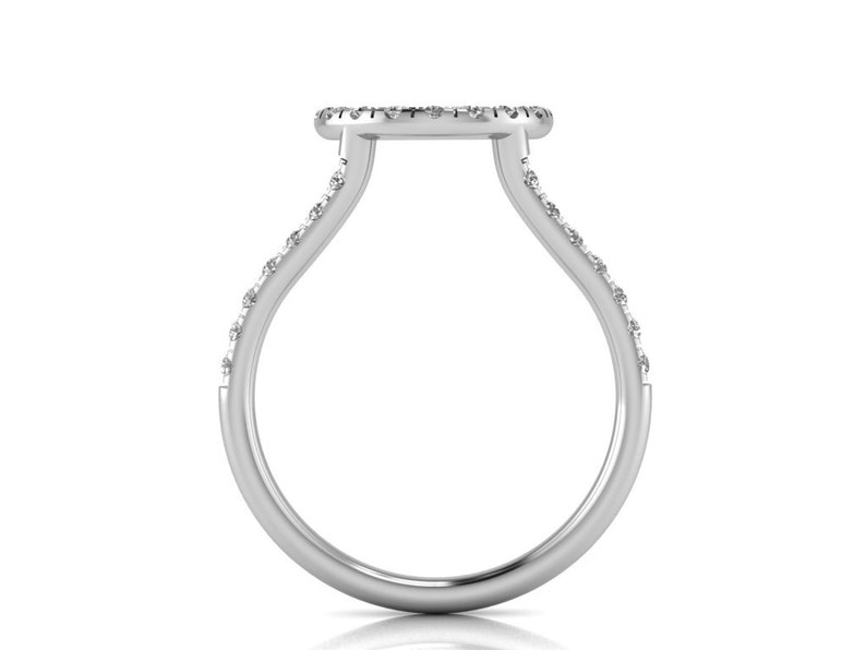 May include: A silver ring with a round, pave-set diamond center and a band that is set with smaller diamonds.