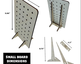 May include: A light-colored wooden display board with 40 peg holes. The board is 9.88 inches tall and 5.88 inches wide, with two supporting legs. The text "SMALL BOARD DIMENSIONS 40 PEG HOLES" is visible.