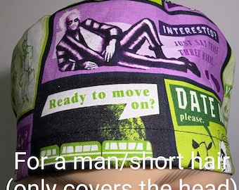 May include: A patterned scrub cap featuring a purple and black design with the image of a character and text that reads "INTERESTED?" and "Ready to move on?" The cap is green and black with the text "DATE please."