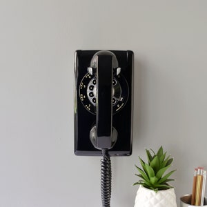 Rotary wall phone restored and working, black wall mount retro telephone