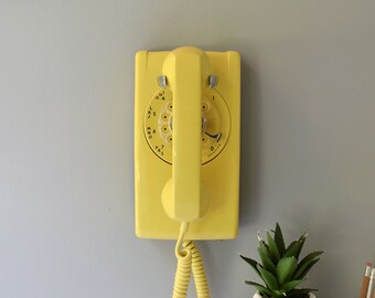 Yellow rotary dial wall phone restored and working