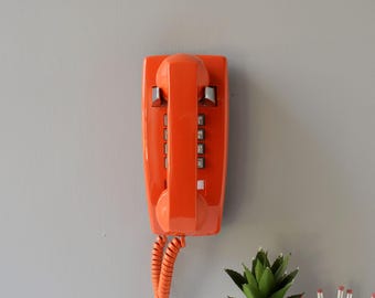 Retro touch tone wall phone in orange, restored and working
