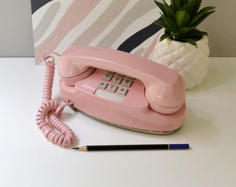 Touch tone princess phone in pink, restored and working