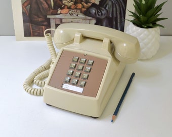 Beige push button desk phone, restored and working touch tone telephone