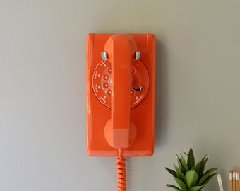 Rotary wall phone in orange restored and working