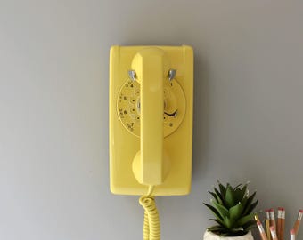 Rotary dial wall phone restored and working, yellow
