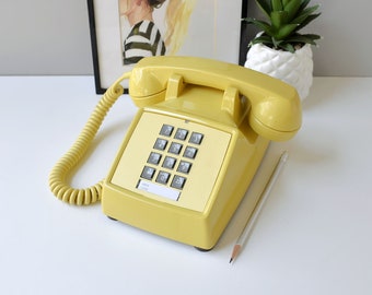 Yellow push button desk phone, restored and working touch tone telephone