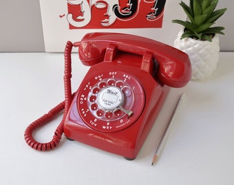 Red rotary dial telephone restored and working