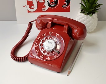Red rotary dial desktop telephone restored and working