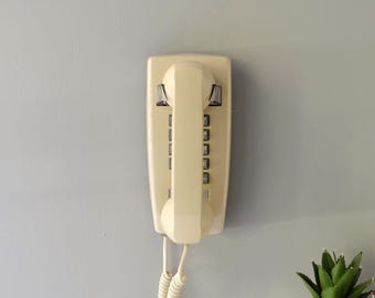 Retro touch tone wall phone in beige, restored and working