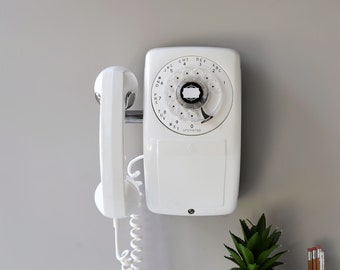 White rotary dial side hook wall phone by Automatic Electric, restored and working