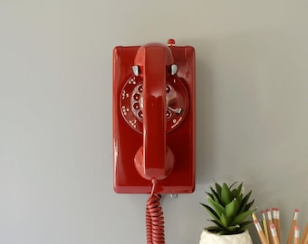 Red rotary dial wall phone with light, restored and working