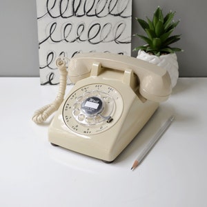 Beige rotary dial desk phone, restored and working