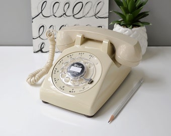 Beige rotary dial desk phone, restored and working